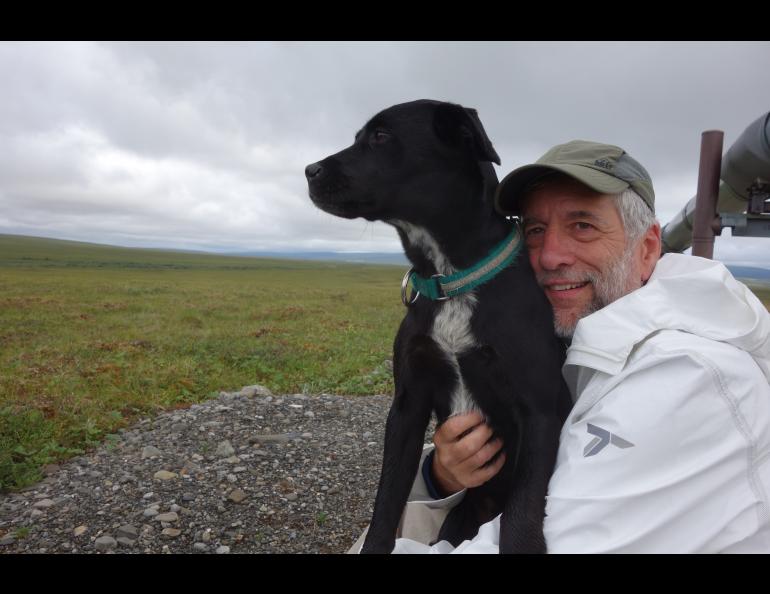 Cora the dog and Eric Troyer, who walked for a week with Ned Rozell on the path of the Trans-Alaska Pipeline. Photo by Ned Rozell.
