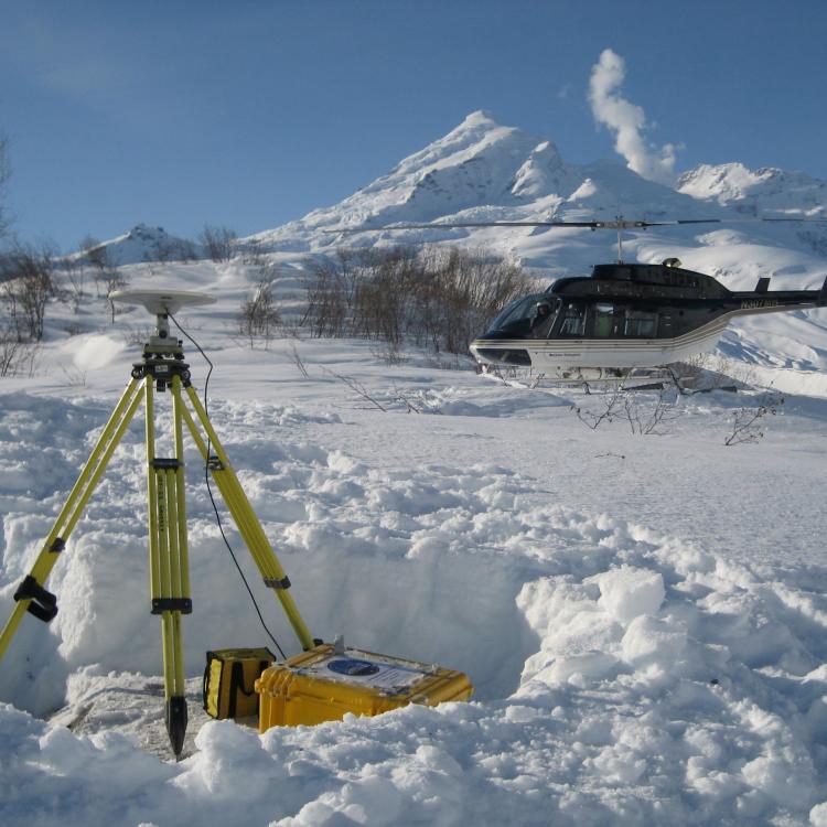 Survey of GPS station DUMM installed just before the 2009 Redoubt eruption. Photo by Max Kaufman, UAF-GI.