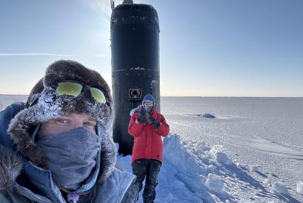 Research professor Andy Mahoney of the University of Alaska Fairbanks Geophysical Institute, left, stands near the USS Hampton’s sail during Operation Ice Camp in March 2024. A civilian employee with the Navy’s Arctic Submarine Lab stands in front of the sail. Photo courtesy of Andy Mahoney