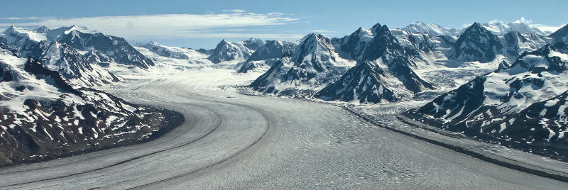 Road going through the snow-capped mountains