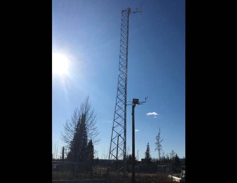 A meteorological tower owned and operated by the Alaska Climate Research Center monitors climate and weather in the Fairbanks area. The tower was acquired last fall and, this spring, will be able to monitor air quality thanks to a new Purple Air sensor installation. Photo by Telayna Wong.