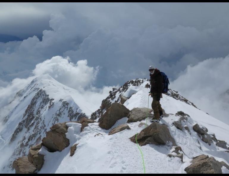 Rhett Foster from CompassData pauses on a ridge leading to the 17,000-foot base camp on Mount McKinley in June 2015. UAF photo by Tom Heinrichs.