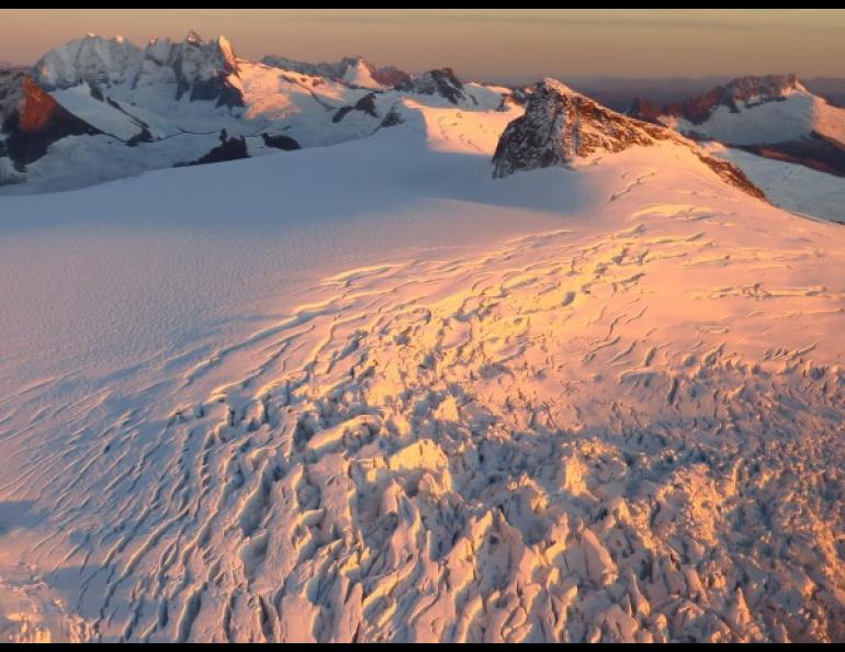 The Mendenhall Towers, upper left, are prominent peaks visible from the Mendenhall Glacier visitor area near Juneau. This photo was taken from a point northeast of the peaks. Photo by Joanna Young.