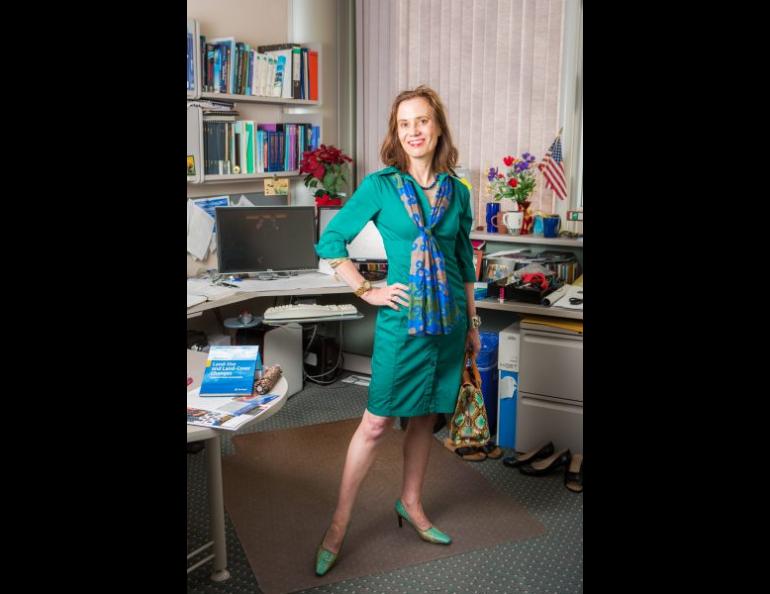 Nicole Mölders poses in her office at the Akasofu Building. Along with her career as an atmospheric scientist at UAF, she is also the author of a fashion blog, High Latitude Style. UAF photo by JR Ancheta.