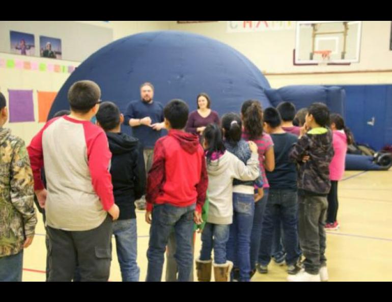 Shungnak students prepare to watch “Kiuguyat: The Northern Lights” in the UAF Geophysical Institute’s portable planetarium dome. Photo by Joan Reynolds.