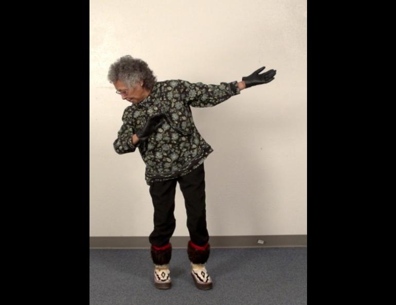 Fannie Akpik, of Barrow, demonstrates the Inupiat Northern Lights Dance. Photo courtesy of Cultural Connections.