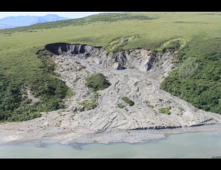 A large retrogressive thaw slump on the Noatak river; the top of the slump is about 900 feet above river water level. Retrogressive thaw slumps are caused by thawing of ice-rich permafrost and subsequent melting of ground ice on slopes. Photo by Rory Nichols.