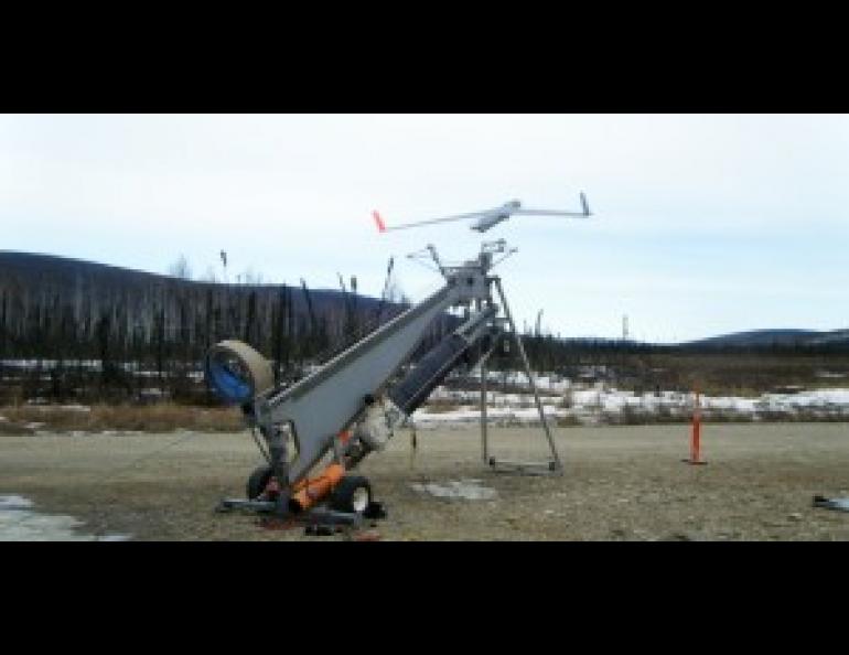 The 40-pound Insitu ScanEagle is catapulted from the launcher to begin a test flight at Poker Flat Research Range in preparation for the upcoming Alaska Shield Exercise. Photo by Amy Hartley.