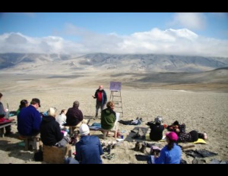 Students of the 2011 International Volcanological Field School take in a lecture in Katmai National Park & Preserve with the Valley of Ten Thousand Smokes and Mount Griggs as the backdrop. Photo by Pavel Izbekov.