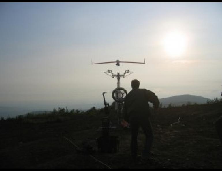 Dale Nash, chief operating officer of the Alaska Aerospace Development Corporation, stands behind the launcher as one of the University of Alaska Fairbanks’ unmanned aerial systems takes flight on June 22, 2007. Photo by Martin Susser, Insitu, Inc.