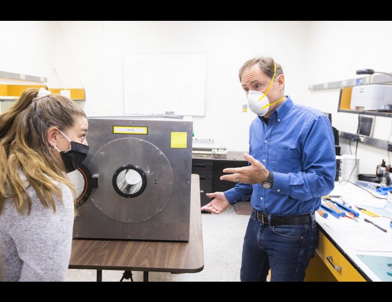 Jeff Rothman trains Mindy Lagonegro, nursing supervisor for the Fairbanks Correctional Center, on how to use the UV disinfection unit built by the Geophysical Institute’s Electronics and Machine shops. UAF Photo by JR Ancheta.