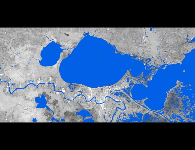 Surface water extent is shown (blue) around New Orleans on Aug 29, 2021. Water extent data is derived from synthetic aperture radar. A SAR image is in the background. Credit: UAF Geophysical Institute.