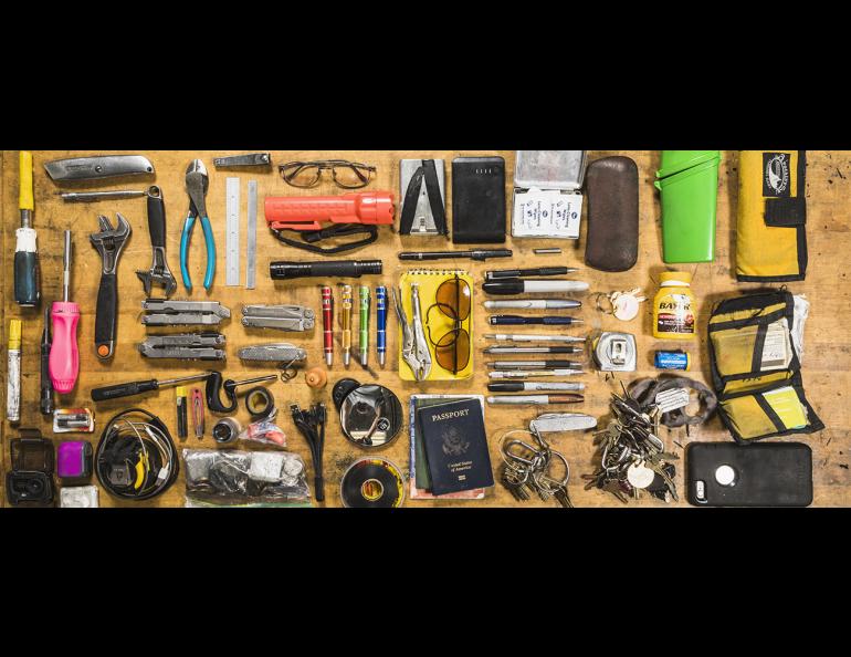 The contents of Dale Pomraning’s pockets cover a table at the Geophysical Institute Machine Shop. UAF photo by JR Ancheta.