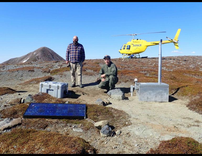 Max Enders of the U.S. Geological Survey and Max Kaufman of the UAF Geophysical Institute at the temporary seismic station they had just finished installing on Crater Ridge. Enders and Kaufman are also with the Alaska Volcano Observatory. Photo by Max Kaufman/Alaska Volcano Observatory