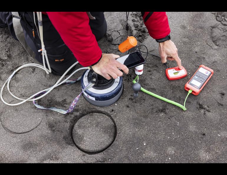 David Benavente of the University of Alicante in Spain records carbon dioxide emitting from the Kruzof Island beach in Southeast Alaska. He is part of the international team seeking to learn more about Mt. Edgecumbe volcano. Photo by JR Ancheta.