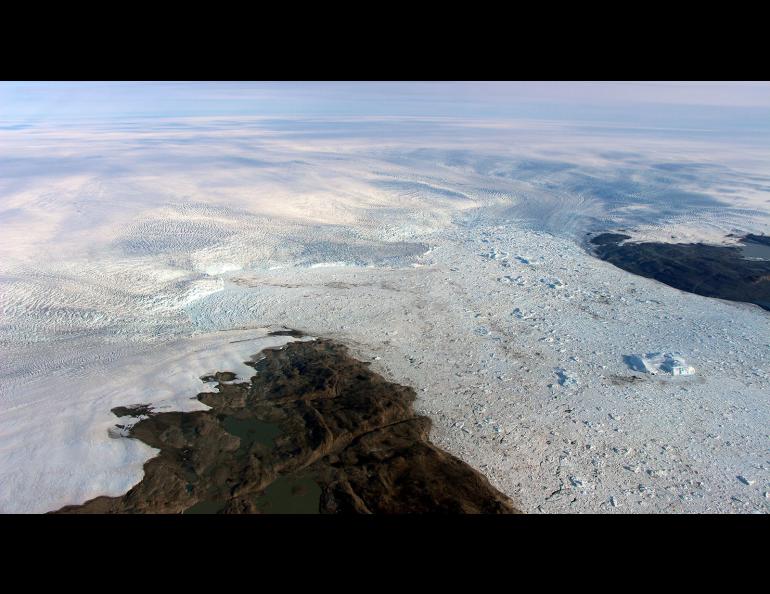 Jakobshavn Glacier calves icebergs into the ocean. Photo by John Sonntag/NASA