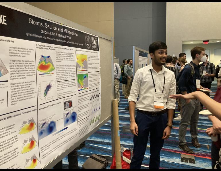 Ph.D. student Sebin John presents his research on observing the impact of ocean storms and sea ice on seismic background noise across Alaska. Photo by Mike West