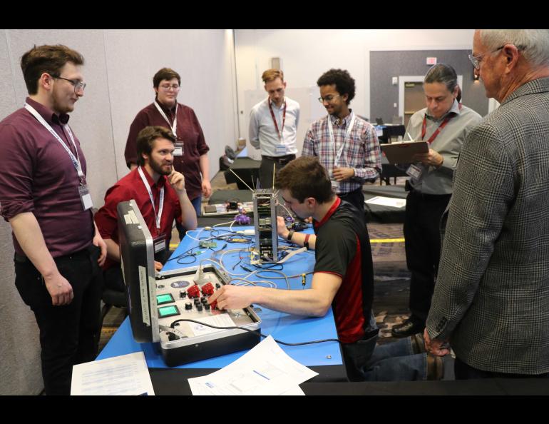 Students demonstrate their satellite in front of judges at their January presentation in New Mexico. Photo by Jessie Perkins, Air Force Research Laboratory.