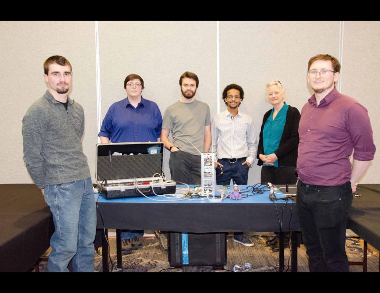 The University of Alaska Fairbanks nanosat team gathers at their January presentation in New Mexico. From left to right, Brian Bieshelt, Caleb Fronek, Evan Joshua Jones, Dominique Hinds, UAF Space Grant Director Denise Thorsen and Anthony Melkomukov. Photo courtesy of Denise Thorsen.