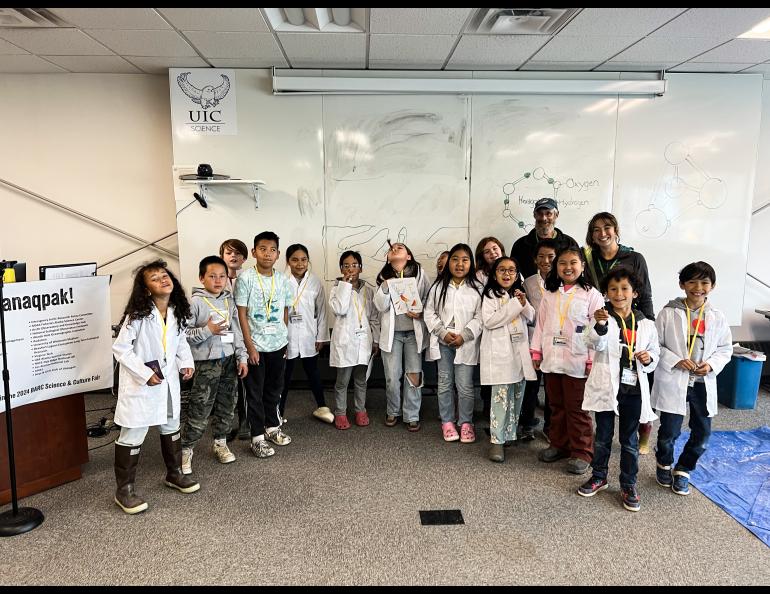 The Geophysical Institute's Serina Wesen and Matthew Sturm with students at the BARC Science & Culture Fair, August 2024. Photo by Bernice Oyagak