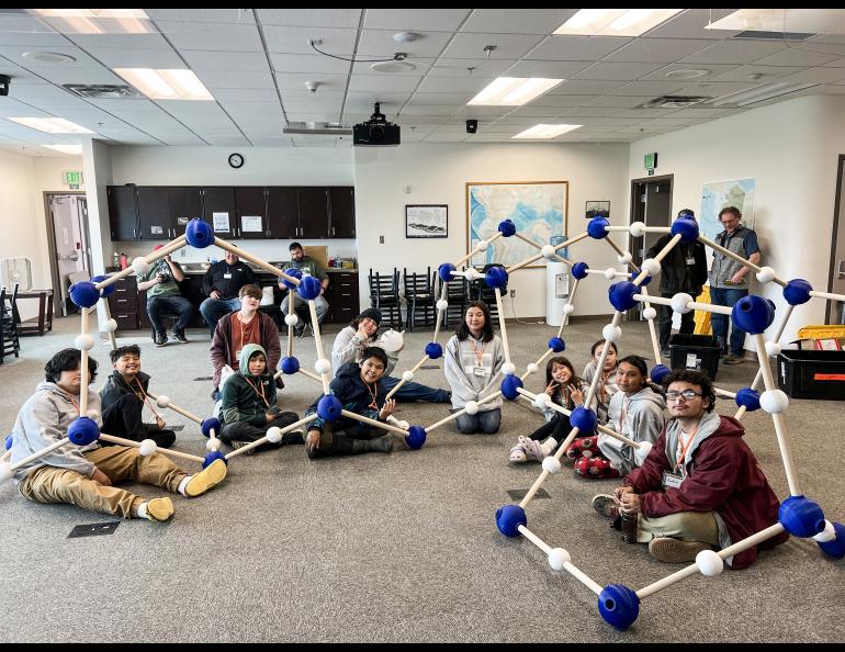 Students after building the XL 3D Frozen Water Molecule, that represents a scientifically accurate ice lattice structure at the BARC Science & Culture Fair. Photo by Serina Wesen