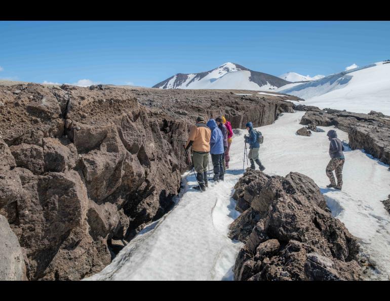 Students examine cracks formed after lava that flowed over the Mageik Glacier in Alaska’s Katmai National Park and Preserve. Photo by Seth Adams