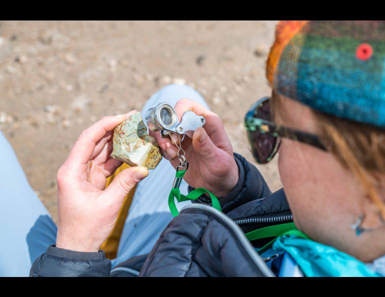 Student Jess Feenstra examines an object during the 2024 International Volcanological Field School. Photo by Seth Adams