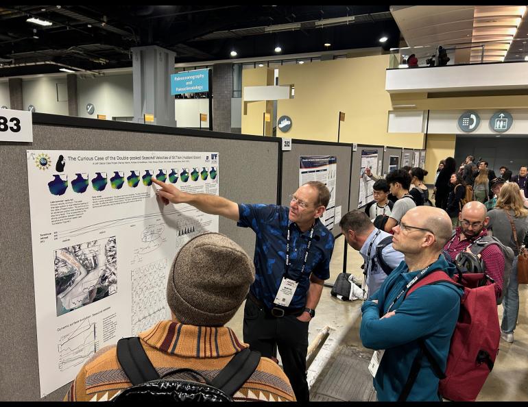 Professor Martin Truffer discussing his work with an attentive crowd. Photo by Rod Boyce