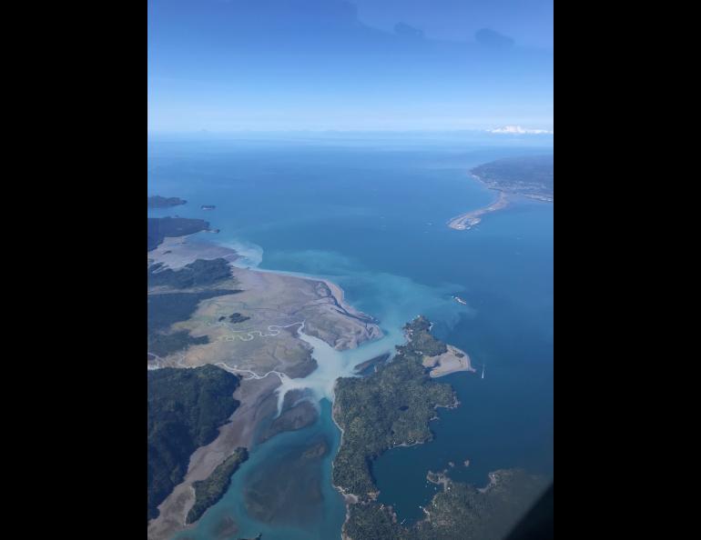 Cloudy water from the Wosnesenski River enters Kachemak Bay across from the Homer Spit on Aug. 28, 2021. Sediment-laden runoff from the Wosnesenski Glacier forms a turbid plume as it spreads from the river mouth into the bay. Photo by Martin Stuefer