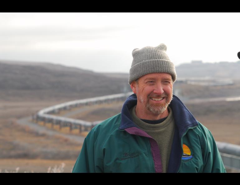 Brian Barnes listens to a colleague while studying ground squirrels near the trans-Alaska pipeline north of the Brooks Range on Sept. 21, 2007. Photo by Øivind Tøien.