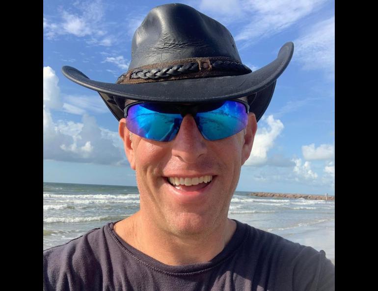 “Hurricane Hal” Needham smiles on a benign day on a Galveston, Texas, beach. The extreme weather and disaster scientist for CNC Catastrophe & National Claims recently drove to a parking garage in southwest Florida to document Hurricane Ian. Photo courtesy Hal Needham.