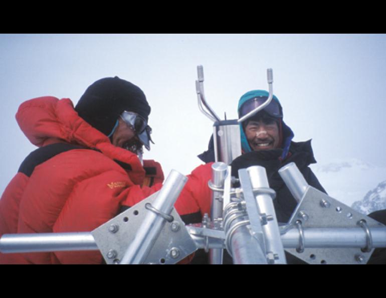  Yoshitomi Ukura, left, of the Japan Alpine Club, and Tohru Saito of UAF's International Arctic Research Center, work on a weather station installed high on Mt. McKinley. 