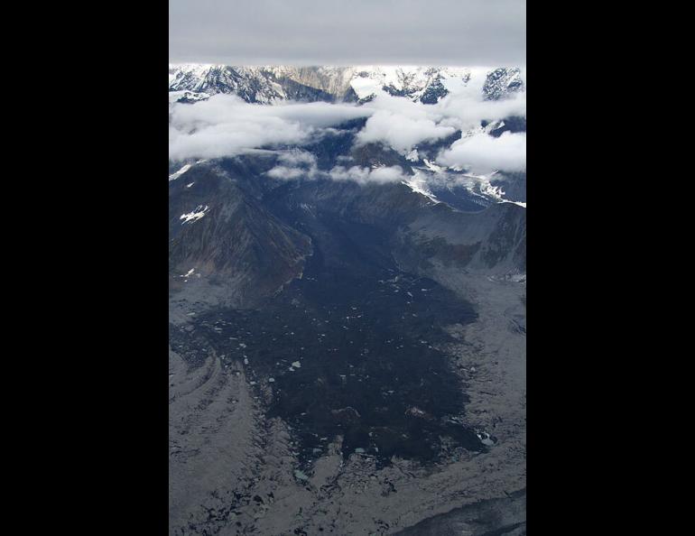  A view of an enormous rock delta from the avalanche of Mt. Steller that registered on seismometers all over Alaska. The amount of rock and ice that fell was equal to a pile one mile long, one-third mile wide, and 50 yards high. Ruedi Homberger photo, courtesy of Ultima Thule Lodge. 