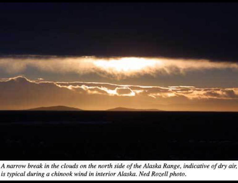 A narrow break in the clouds on the north side of the Alaska Range, indicative of dry air, is typical during a chinook wind in interior Alaska. Ned Rozell photo. 