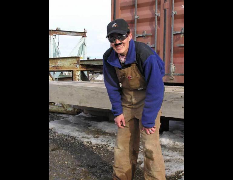  Raven researcher Stacia Backensto disguises herself as an oilfield worker in an attempt to fool ravens she has captured before. Photo by Jim Zelenak. 