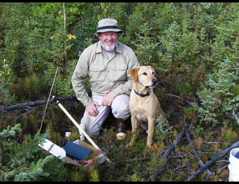  Tom Osterkamp with his Labrador retriever Happy at a permafrost-monitoring site near Bonanza Creek west of Fairbanks in 1999. Photo courtesy Tom Osterkamp. 