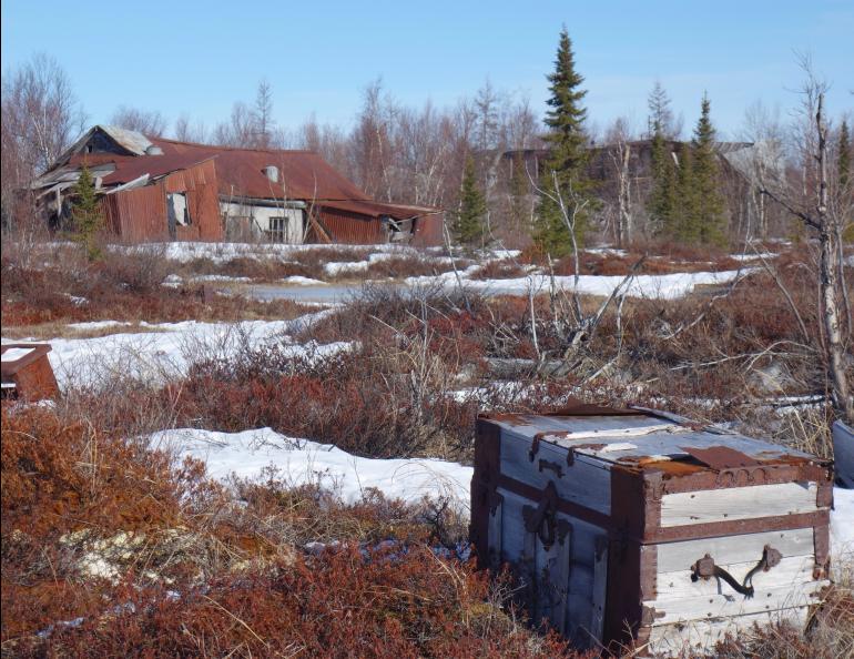 A travel trunk on the tundra in the ghost town of Iditarod. Photo by Ned Rozell.