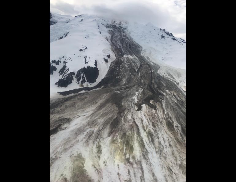 The June 2019 rock-and-ice avalanche down Red Glacier on Iliamna Volcano, taken on a flyover a few days later by Loren Prosser of Ninilchik. Photo by Loren Prosser, courtesy of Alaska Volcano Observatory.