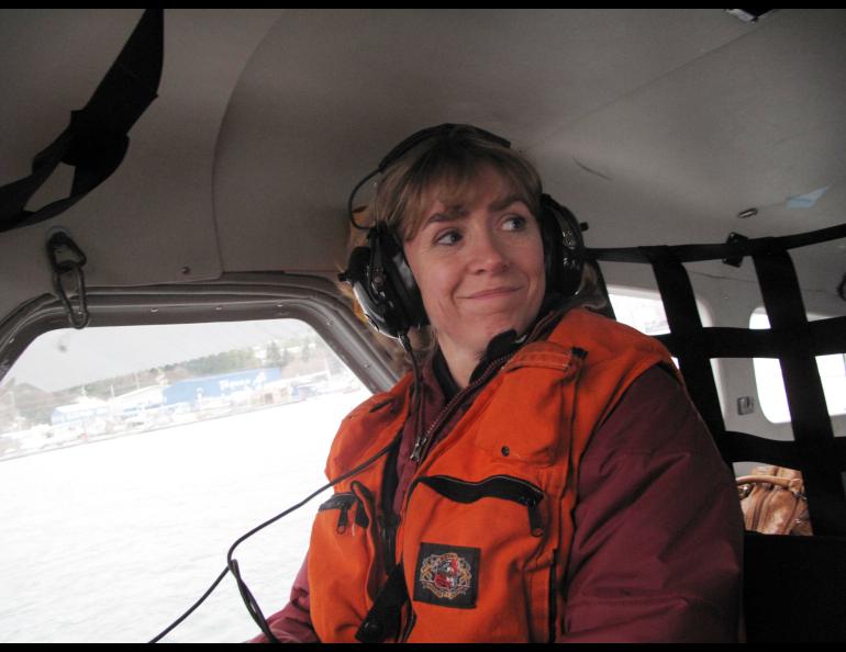 Seismologist Natalia Ruppert smiles from within the cockpit of an amphibious aircraft during a 2013 trip to Sitka and Craig following a large earthquake in the area. Photo by Ned Rozell.