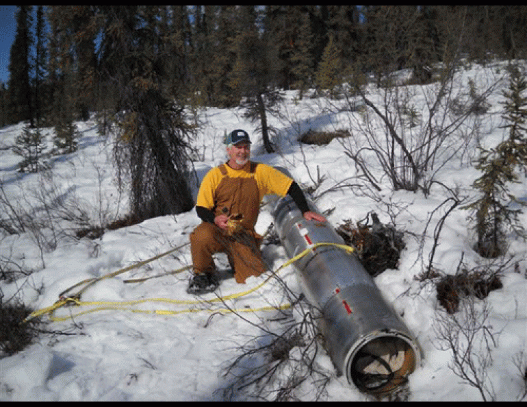 Chris Christenson of NASA helps attach a rocket payload to a helicopter sling near a small arctic creek 170 miles north of Chatanika, Alaska, from where the rocket launched a few days before.