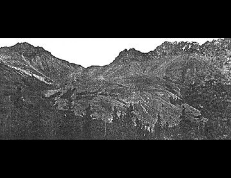  The photograph shows particularly well the characteristic steep apron lying at the angle of repose above the toe of the glacier.