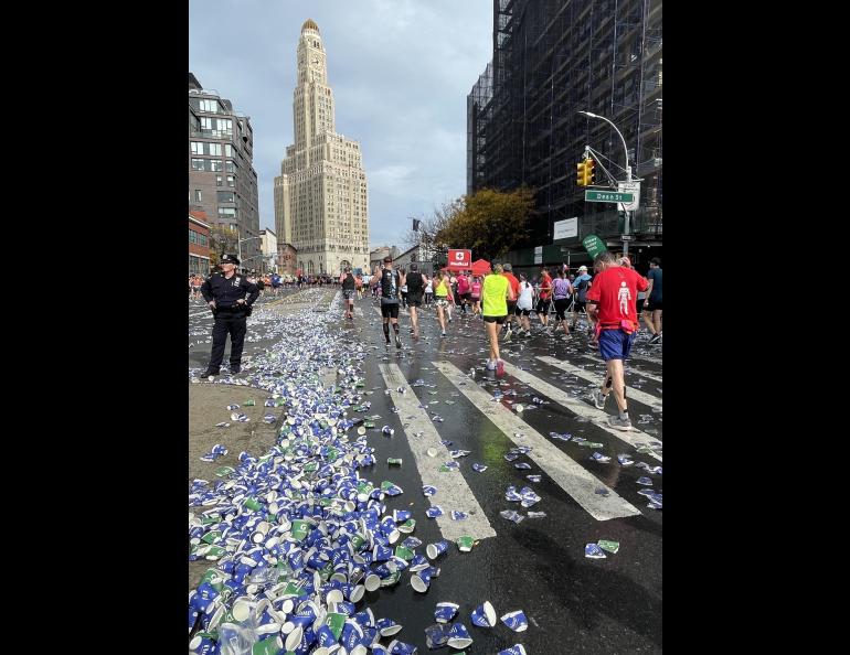 Cups that held sports drinks and water pile up on a Brooklyn Street during the New York City Marathon on Nov. 6, 2022. Photo by Ned Rozell.