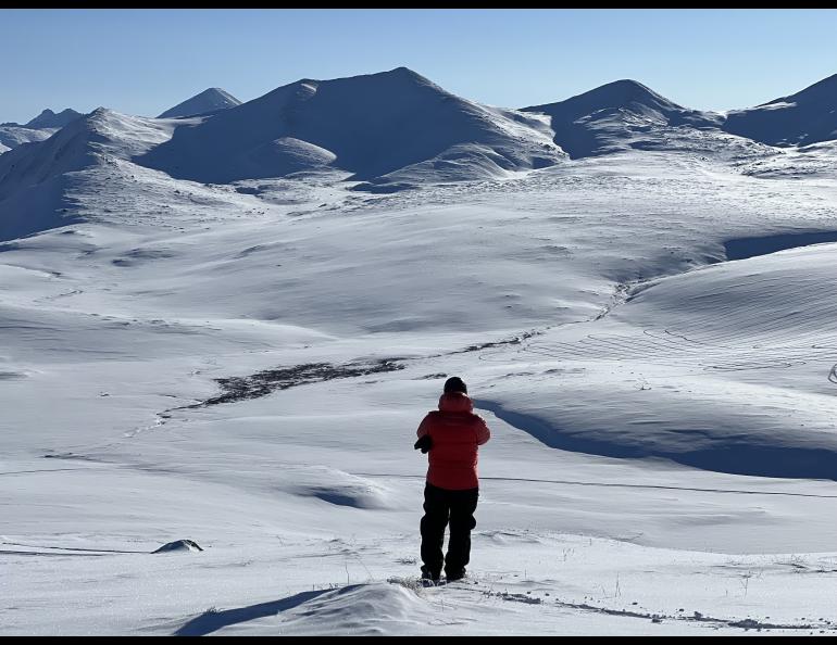 HP Marshall of Boise State University takes a photo of Alaska’s North Slope north of the Brooks Range during a snow survey as part of a NASA experiment. Photo by Sveta Stuefer.