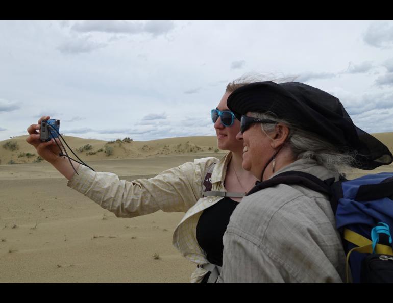 Fifteen-year-old Ida Bodony takes a selfie of herself and her mother Karin Bodony in the Nogahabara Dunes. They were there recently for a week to perform research recently in the heart of the Koyukuk National Wildlife Refuge. Photo by Ned Rozell.