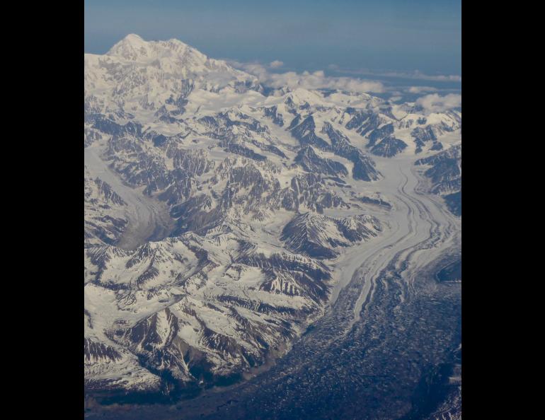 Denali, at 20,310 feet the highest mountain in North America, rises in central Alaska as seen from an airline flight from Fairbanks to Anchorage. Photo by Ned Rozell.