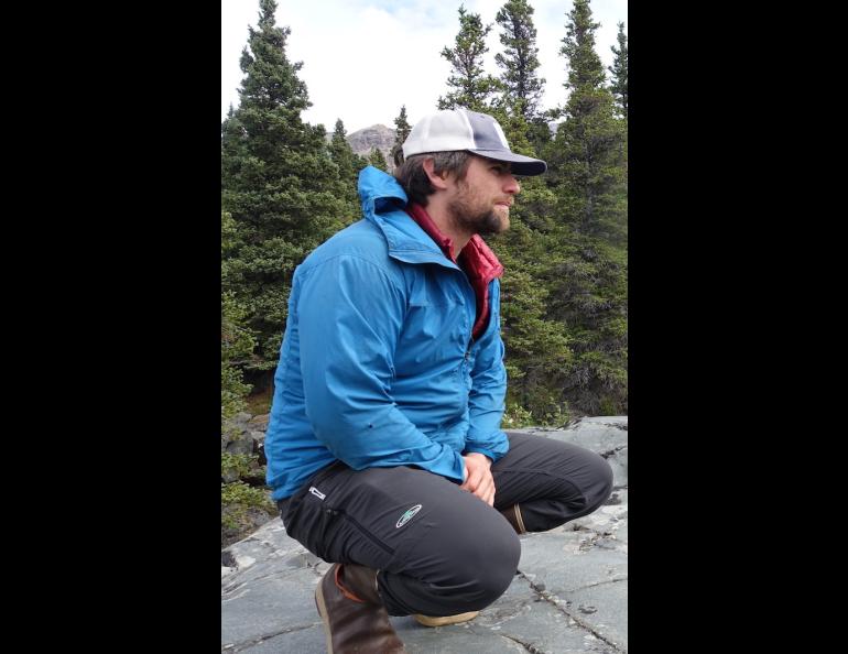 Phillip Wilson listens to Dan Mann talk about the surges of Black Rapids Glacier at a military training site south of Delta Junction. Photo by Ned Rozell.