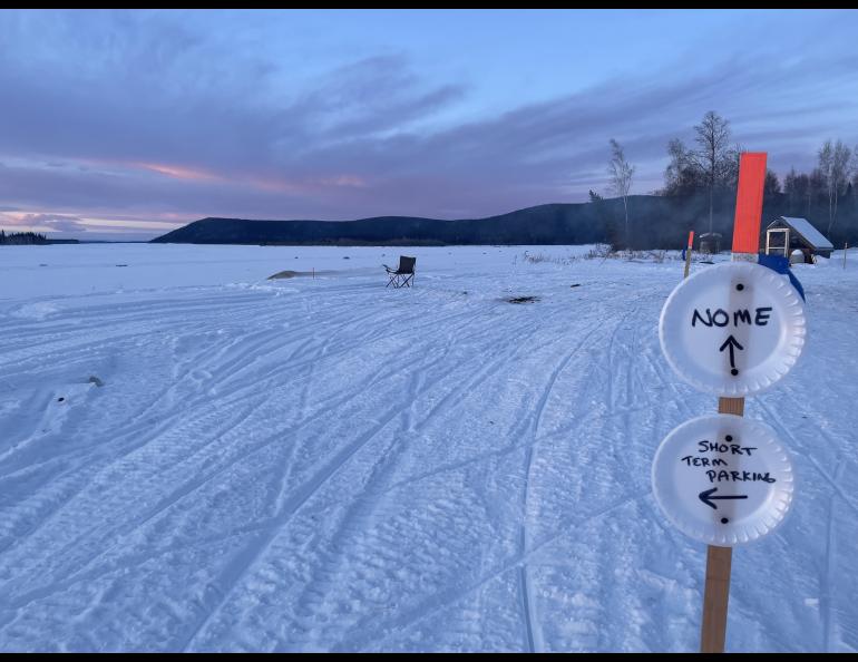 Signs in front of Tolovana Roadhouse instruct Iditarod mushers which way to go during the 2025 Iditarod sled dog race in early March 2025. Photo by Ned Rozell.