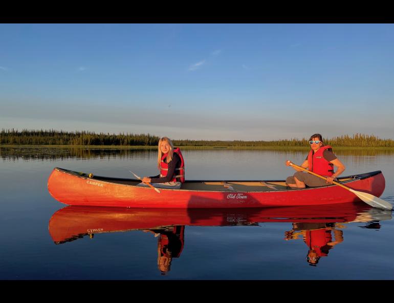 From left, Anna and Kristen Rozell canoe upon Deadman Lake in July 2023. Deadman Lake is part of the 934,513 acres of Tetlin National Wildlife Refuge, established in 1980 as part of the Alaska National Interest Lands Conservation Act. Photo by Ned Rozell.