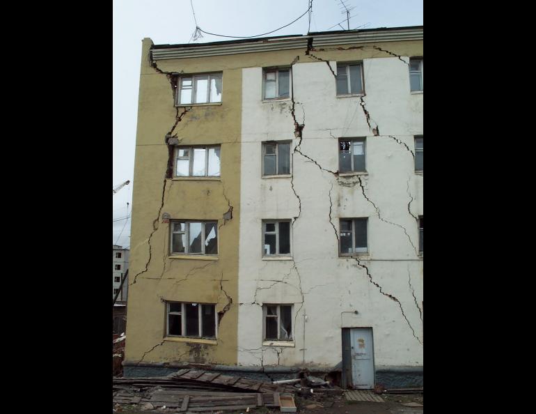 A building in Cherskiy, Siberia, showing the effects of permafrost thaw beneath its foundation. Photo by Vladimir Romanovsky.