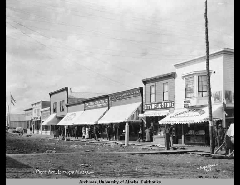 First Avenue in the town of Iditarod around its peak in 1911. Lomen Brothers photo, UAF Archives, image 1985-122-322.